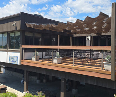 Drugan’s Castle Mound golf shop features a spacious patio with sunshade panels and outdoor seating overlooking the scenic course.