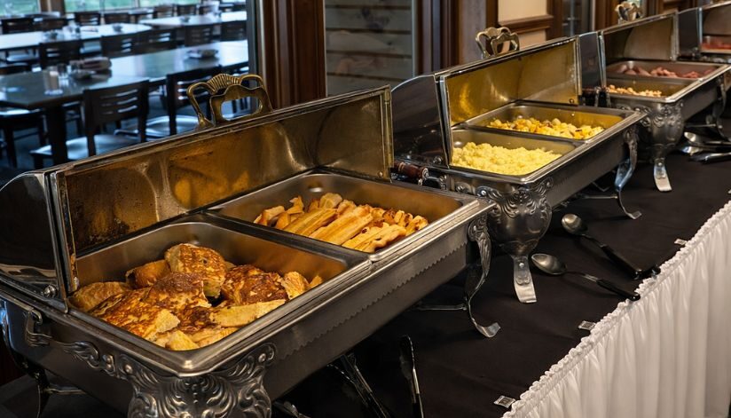 Drugan’s Castle Mound's breakfast buffet displays French toast, bacon, scrambled eggs, and other hot foods.