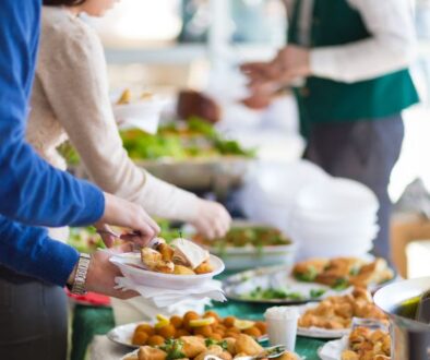 Guests help themselves to a buffet of assorted dishes and drinks during an event at Drugan’s Castle Mound in Holmen, Wisconsin.