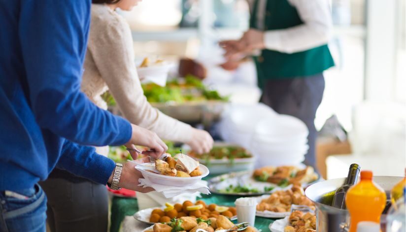 Guests help themselves to a buffet of assorted dishes and drinks during an event at Drugan’s Castle Mound in Holmen, Wisconsin.