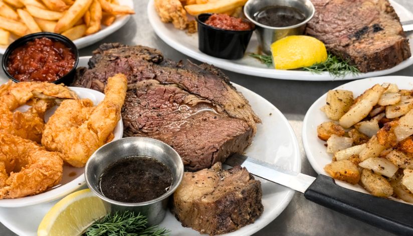 A hearty Supper Club meal with prime rib, fried shrimp, steak, and potatoes at Drugan’s Castle Mound.